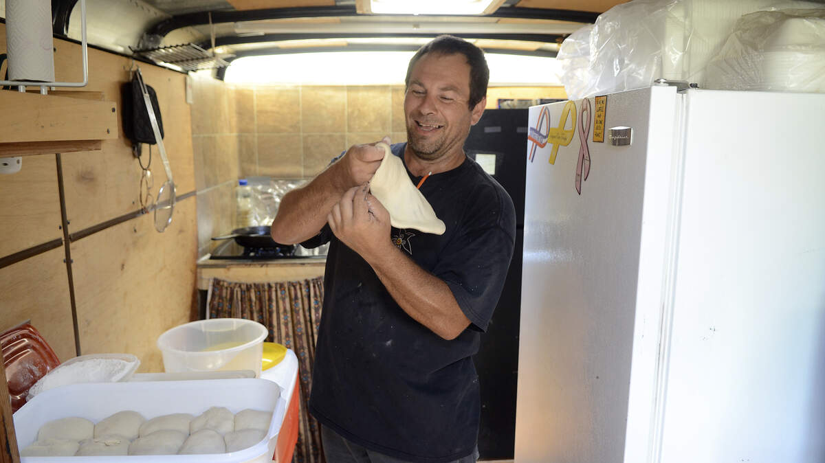 Isaac Vigil work with fry bread dough in his trailer on June, 13, 2014 at the home that he is staying at in Yemassee.  Vigil sells Native American food out of the trailer and will be participating in the Food Truck Fest in Beaufort on Saturday, June 21, 2014.