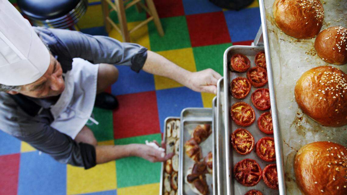 Robert Plantadis, owner of The Midnight Bakers, looks through some of his baked goods March 5 at his bakery in Bluffton's Promenade.