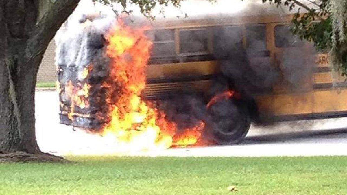 A bus intended to transport students for the ACE Academy serving Beaufort and Jasper counties catches fire the morning of Sept. 3, 2015.