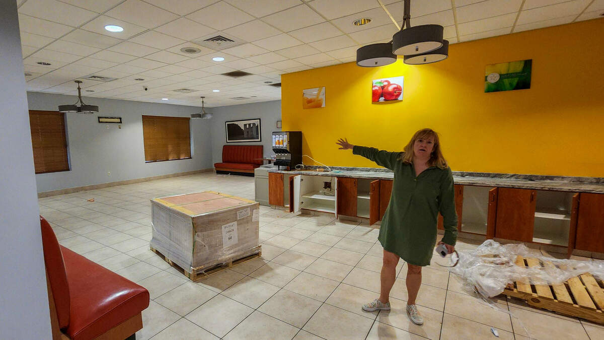 Courtney Worrell, CEO of 303 Associates, explains how the former dining area at Quality Inn hotel will be offered as a shared eating space where residents can gather with guests for pizza parties or celebrations.