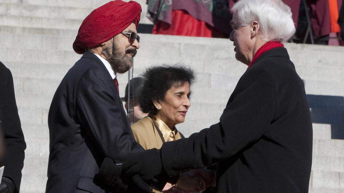 SC Gov. Nikki Haley’s father, Ajit Randhawa, shakes hands with Rep. Grady A. Brown, D-Lee, during Haley’s 2011 inauguration on the State House steps as her mother, Raj, looks on.