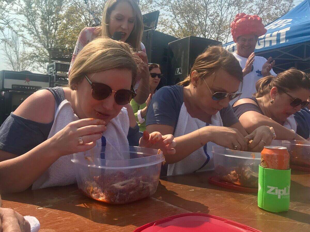 Participants chomp down as many wings as possible for two minutes during the 2018 Hilton Head Wingfest on Saturday, March 24.