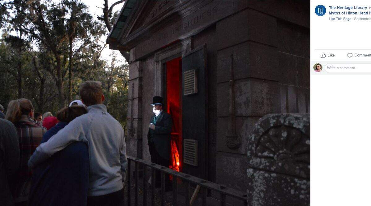 Visitors listen to a storyteller at Baynard Mausoleum during last year’s “Ghosts and Myths of Hilton Head Island” tour.