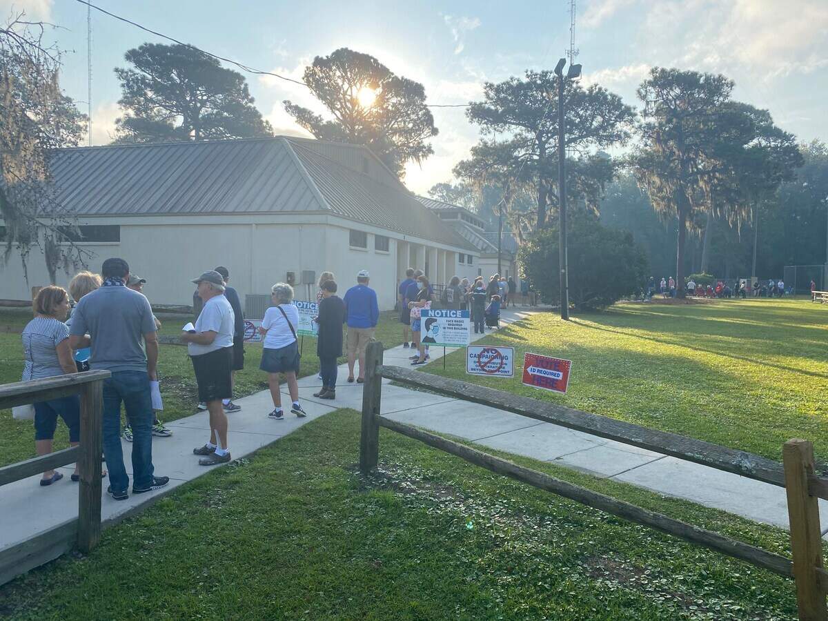 Voters line up to cast their ballots early at the elections office in Bluffton on Ulmer Road on October 14, 2020.