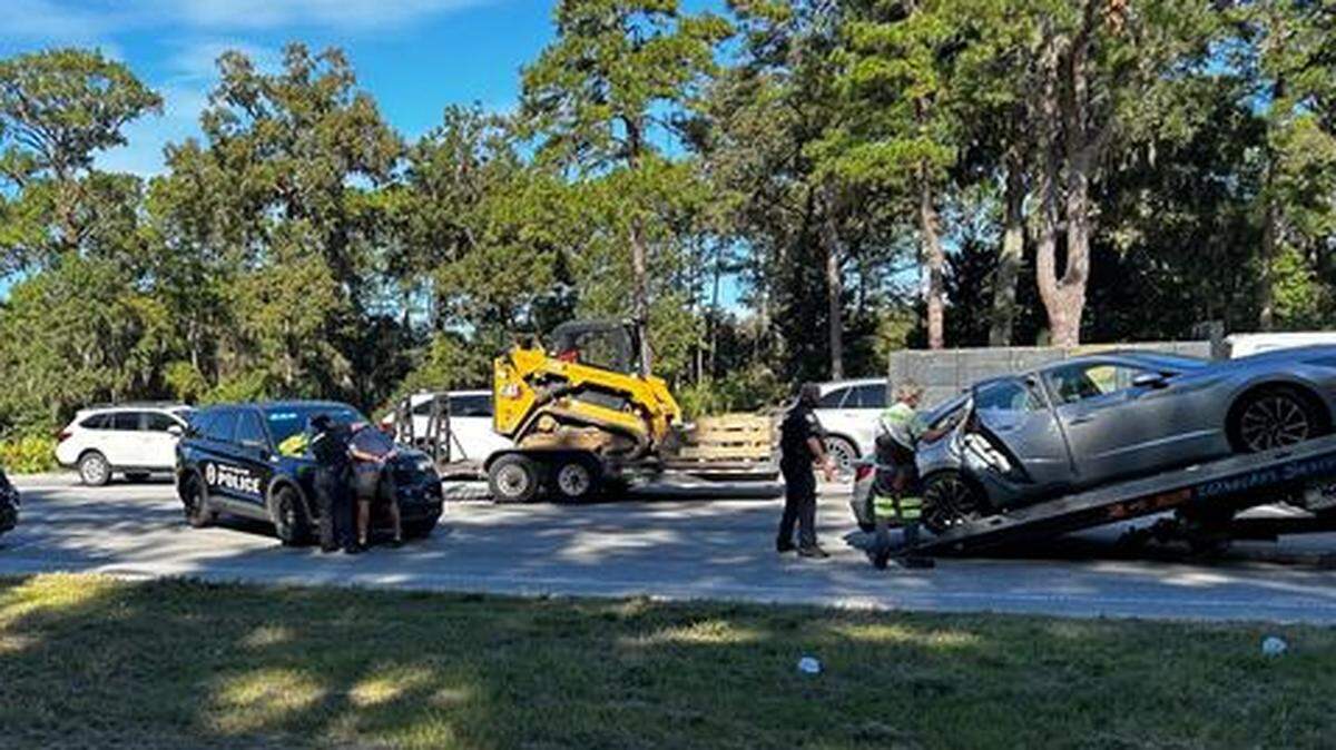 A man in handcuffs was seen bent over the hood of a Bluffton Police Department patrol car at the scene of an accident at the intersection of U.S. 278 and Buck Island Road just after 3 p.m. Thursday.