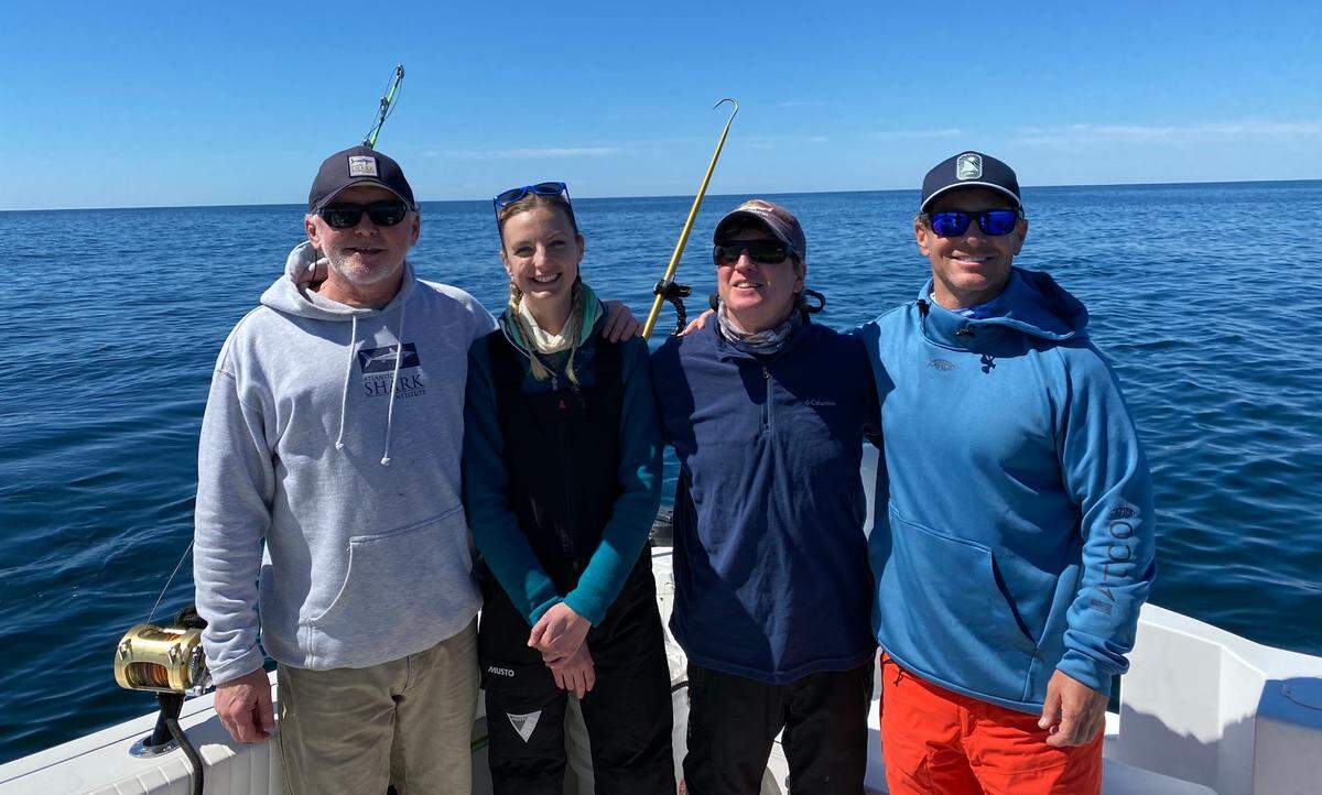 On the water off Hilton Head looking for sharks with a Discovery Channel film crew in February are, from left, Jon Dodd, executive director of the Atlantic Shark Institute; Michelle Jewell, zoologist studying large sharks; Greg Skomal, marine biologist with the Massachusetts Division of Marine Fisheries; and Chip Michalove of Outcast Sport Fishing.