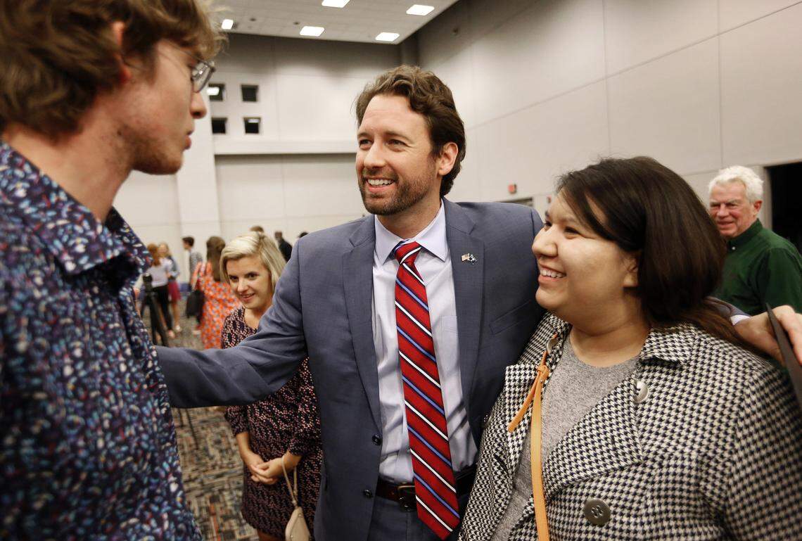 Democrat Joe Cunningham, center, greets supporters after his victory press conference at the International Longshoremen’s Association hall in Charleston, S.C., Wednesday, Nov. 7, 2018. Democratic U.S. House candidate Cunningham used a personal touch and concern for local issues like offshore drilling to beat a Republican in conservative South Carolina.