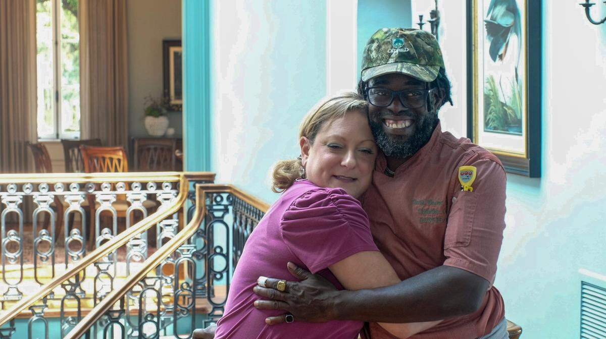 Needing to start preparing dinner, executive chef David Young and his partner, Darcie Jones, share a hug on Friday, Aug. 25, 2022, at Oldfield’s River Club in Okatie. Due to the ever-increasing cost of living on Hilton Head Island, Young, a native islander, and Jones, a 20-year resident, moved to Pineland, S.C., instead of spending a large portion of their income on rent or a mortgage.
