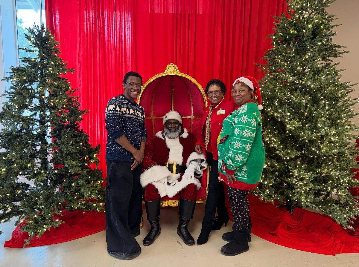 Members of the BCBCC staff pose with Santa during their annual Holiday Market.