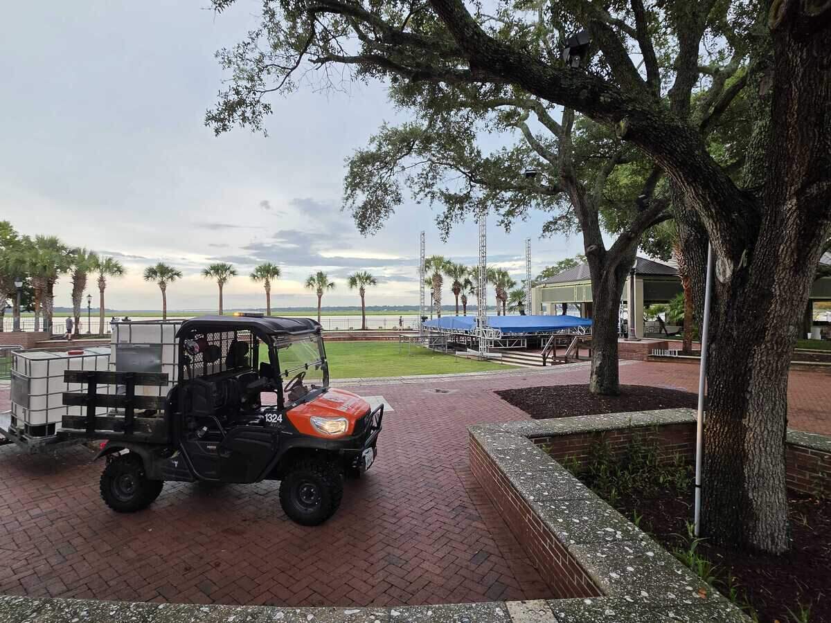 Volunteers with the Beaufort Water Festival work Wednesday evening on putting up the stage at the pavilion in Waterfront Park where the musical acts will perform over the next 10 days.