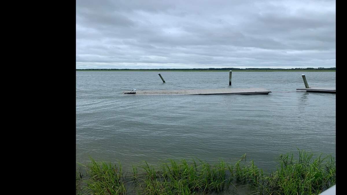 A wall of water washed away docks at Butler Marine Dray Stack and Sales during Tropical Storm Elsa July 7.