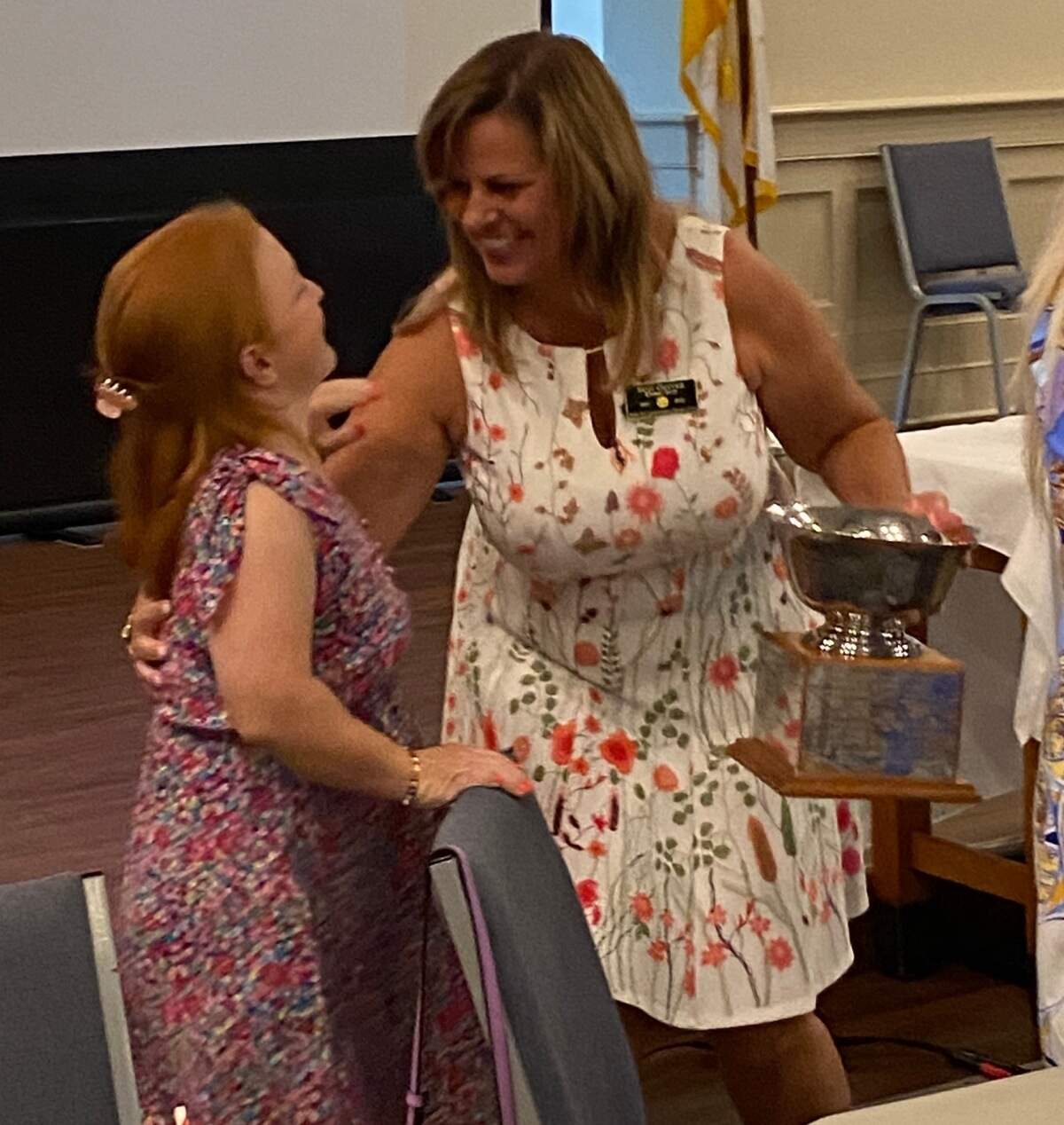 Caroline Welsh, left and Suzi Oliver embrace after Oliver was given the Rotary Club of Beaufort’s highest award for public service. In 2019, Oliver donated a kidney to Welsh, who had kidney disease.