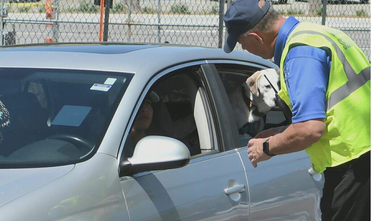 Hilton Head Island resident David Monroy, along with his little brother and their dog Cooper, are turned away from the public parking at Coligny Beach Park by Chuck Hall with Coastal Security Service on Friday, May 1, 2020 by orders of the Town of Hilton Head Island. The town opened the beaches but town-owned parking lots were limited to those with parking passes. “I knew it was open but didn’t know i needed a sticker. I just thought I needed to show I.D.” Conroy said as he turned out of the lot.
