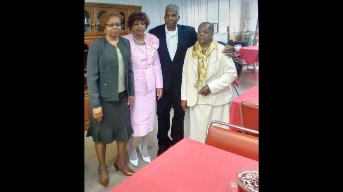 A photograph of the Badger family. From left to right: Lela Holiday, Lucretia Pringle, Roosevelt Badger and Alice Gillison.