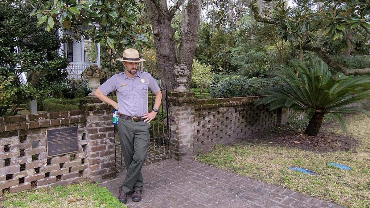 Chris Barr, Chief of Interpretation/Public Information Officer with the Reconstruction Era National Historical Park, stands outside the front gate to Robert Smalls House on Thursday, Feb. 2, 2023 before giving a tour on the steps of the private residence in Beaufort’s historic district.