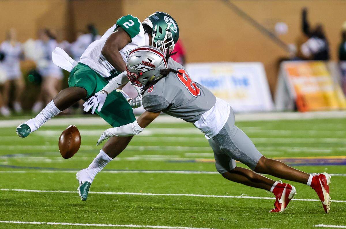 South Pointe Stallions defensive back Isiah Steele (8) knocks the ball loose from Beaufort Eagles wide receiver Kacy Fields (2) in the Class 4A SC State Championship Game at Benedict College in Columbia, SC, Thursday night, December 2, 2021.