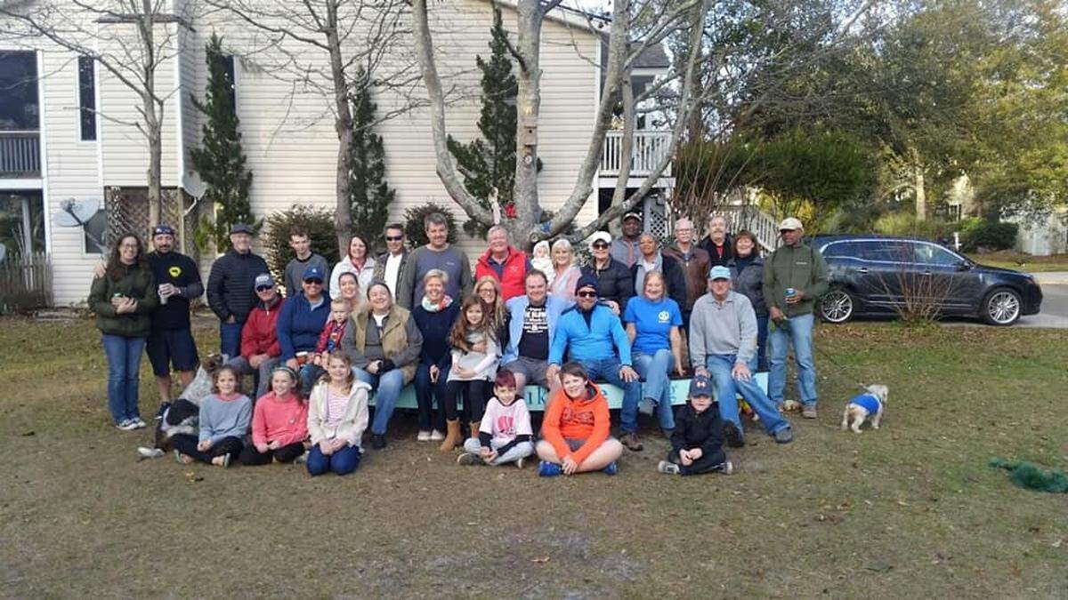 Yacht Cove residents and neighbors on the bench dedicated to Charli Bobinchuck.
