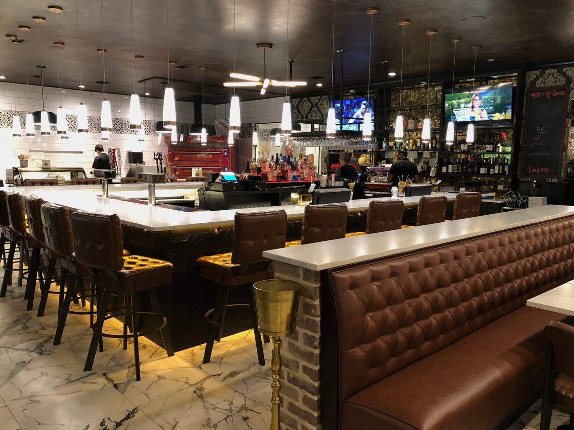 Mama G’s Pizza Bistro and Bar in Moss Creek Village seats 95, including at the bar. 