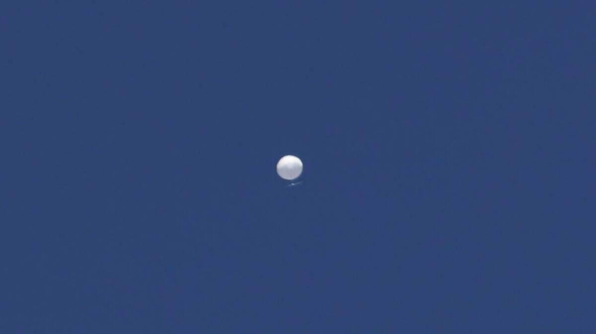 A balloon floats over Columbia, Mo., on Friday, Feb. 3, 2023. A huge, high-altitude Chinese balloon sailed across the U.S. on Friday, drawing severe Pentagon accusations of spying despite China’s firm denials.