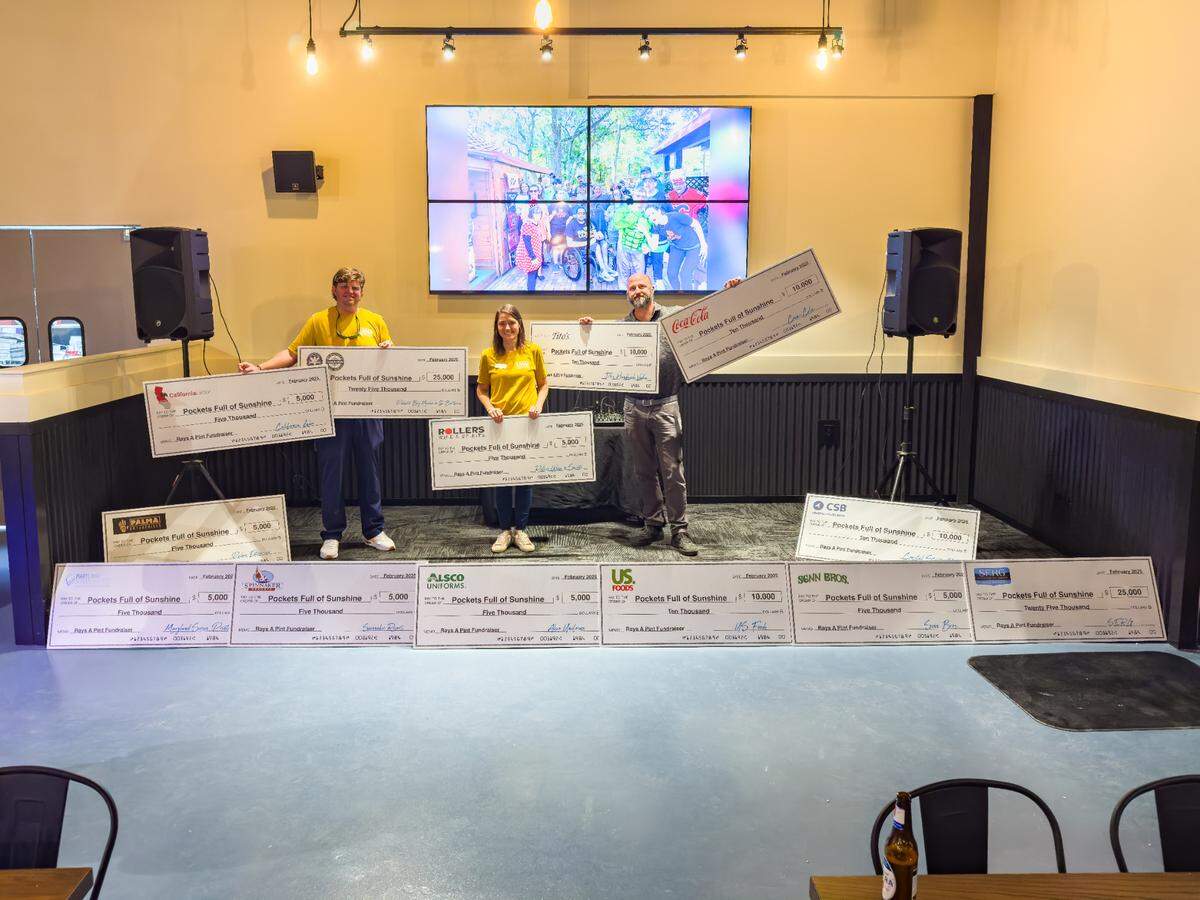 Checks awarded to Pockets Full of Sunshine at the Rays Your Pint Fundraiser, Feb. 16, 2025