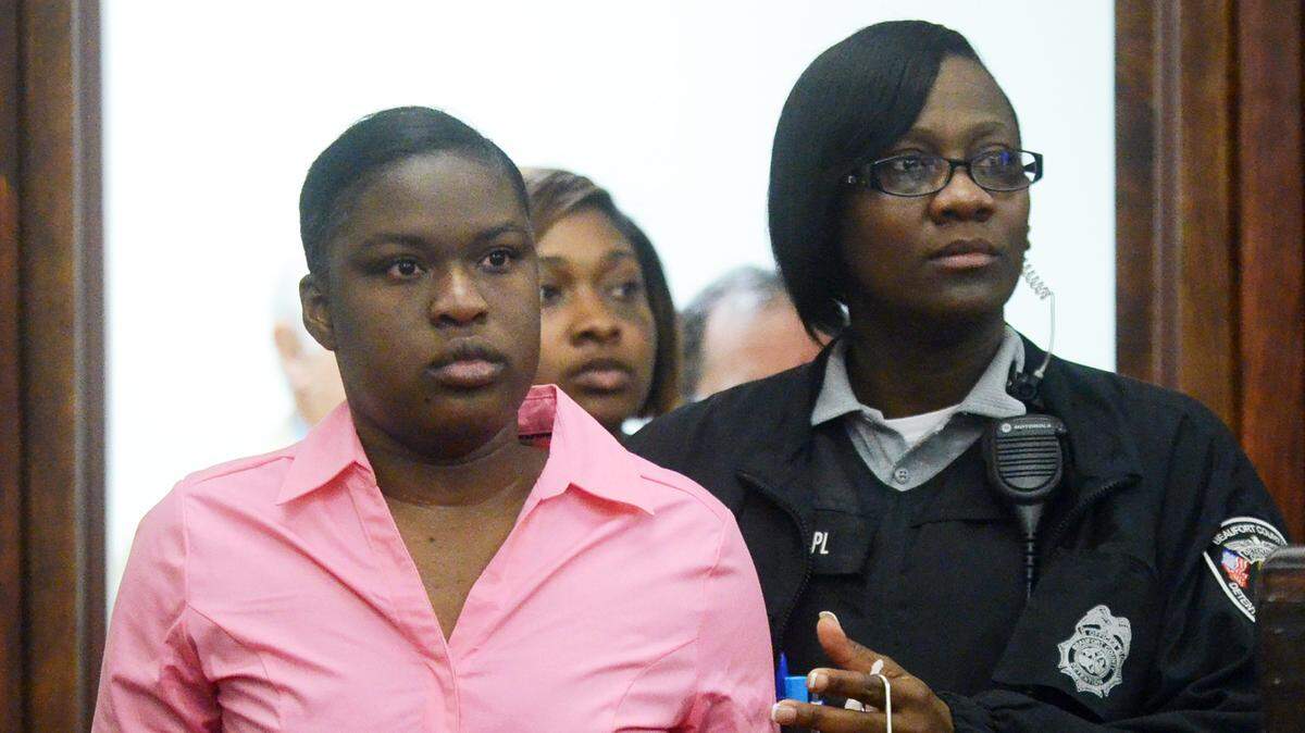 Shayla Bryan is escorted back into the courtroom after a recess in her first trial on May 20, 2014 at the Beaufort County Courthouse. Bryan was accused of severely beating her daughter before throwing her from a third-floor balcony in December 2011.