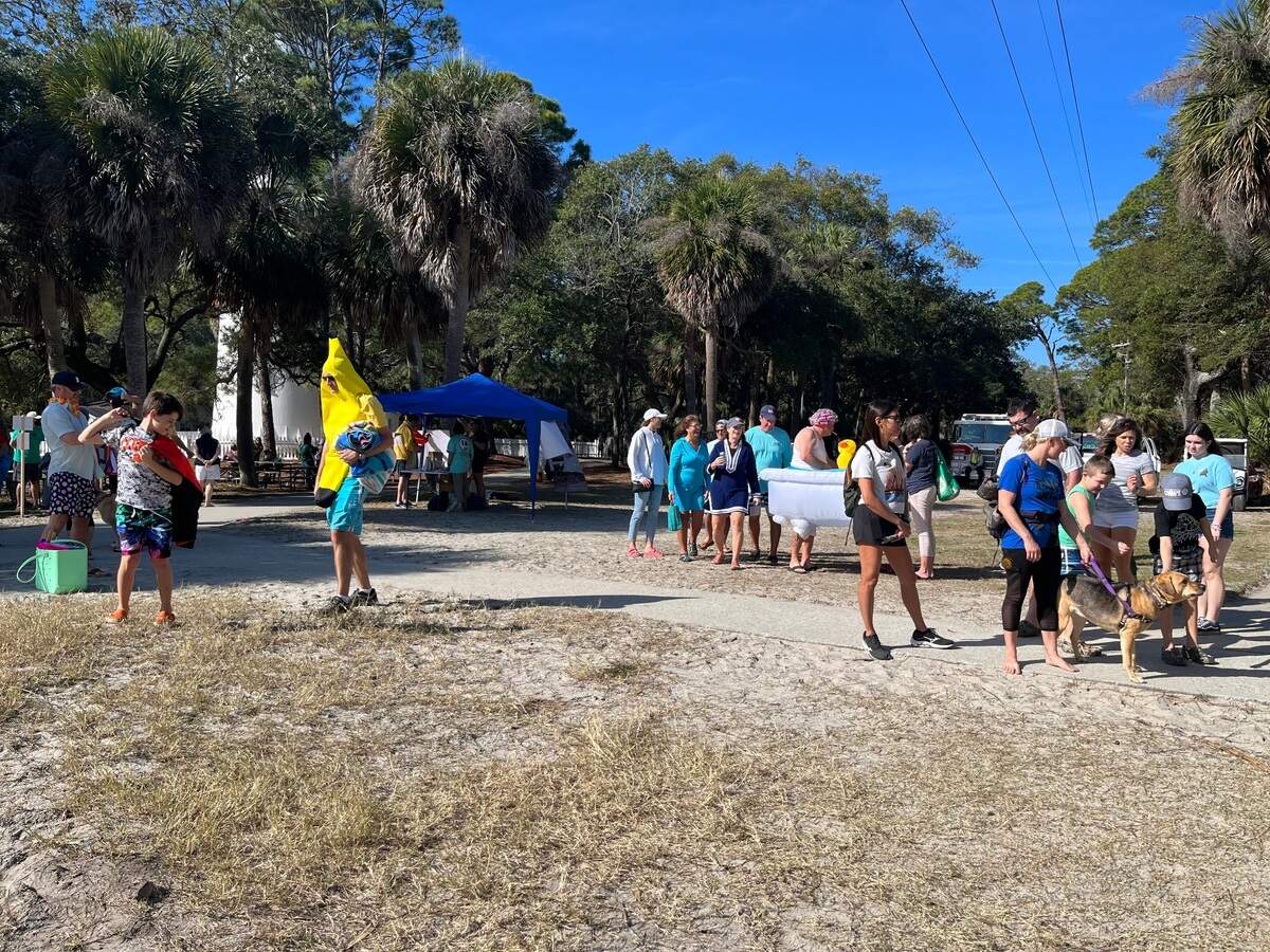 After a brief costume parade, participants ready themselves for the plunge on Hunting Island State Park’s north beach on Jan. 1, 2022.