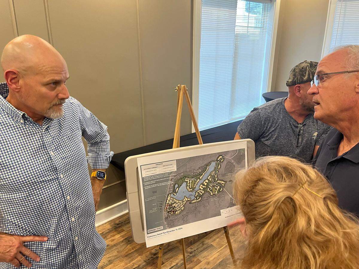 Dennis Ross, left, organized an information meeting on Cat Island to inform residents about housing projects that are planned in the area. Growing development in northern Beaufort County is a concern, he says. “Get up and speak your piece,” Ross urged residents regarding pending development projects.                                                                                                                                                                                                                                                                                                                                                                                                                                                                                                                                                                                                                                              