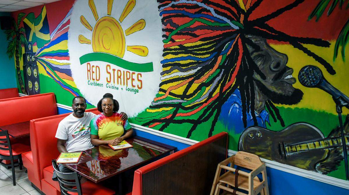 Ezron and Lakesha Daley, owners of Red Stripes Caribbean Cuisine & Lounge, are pictured here on Thursday, Aug. 20, 2020 in their restaurant located on Hilton Head Island. The restaurant announced the closure of its Hilton Head location earlier this month, but the Bluffton location will remain open.