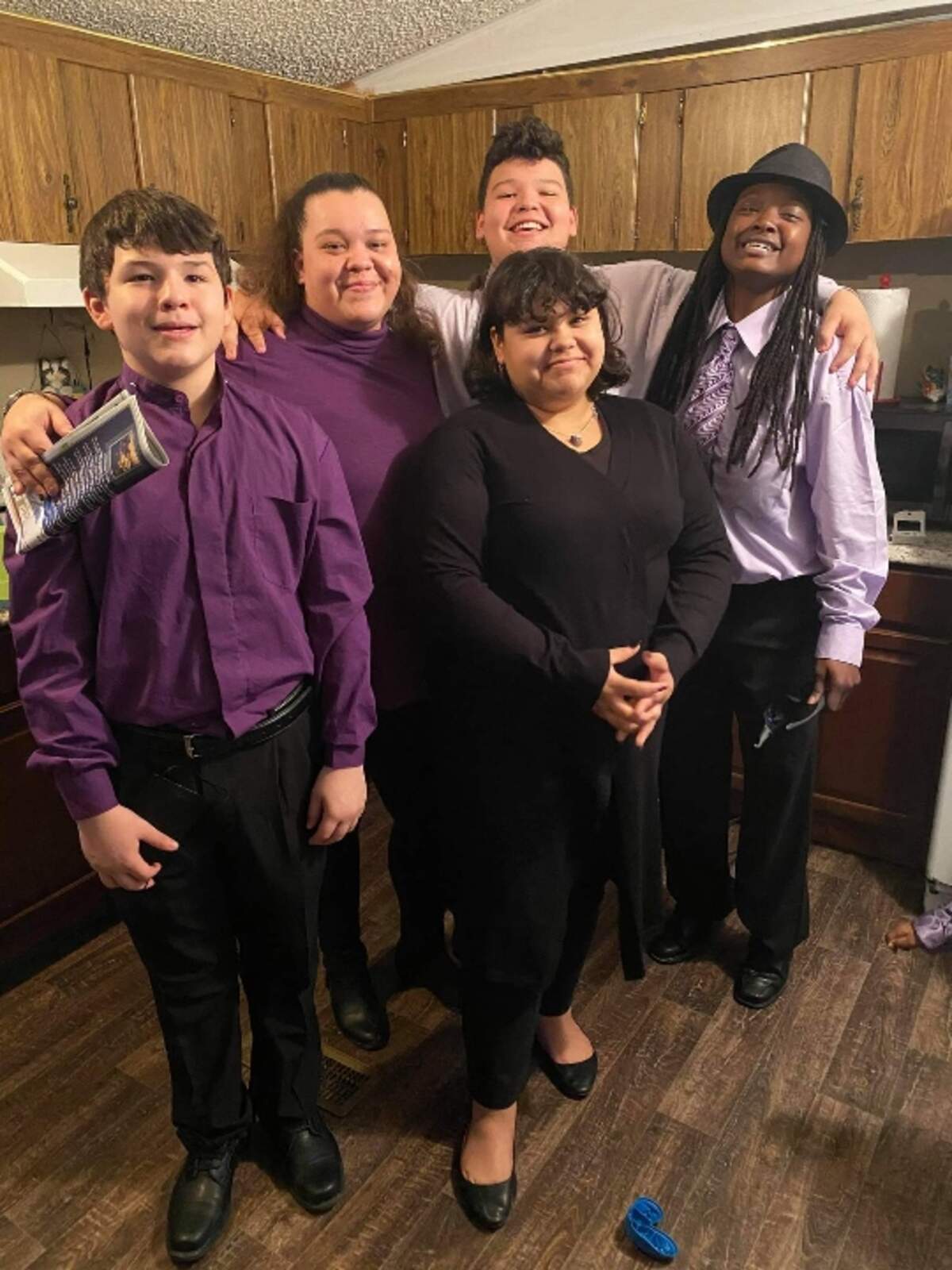 DuPont pictured with her girlfriend of ten years, Shana Smith, and her three children Adriana Campos, Jared Rodriguez and Michael Rodriguez.