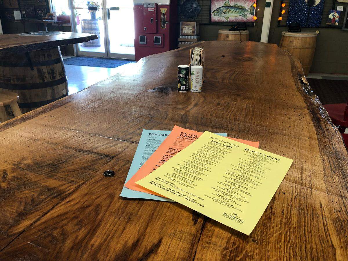 The tables at Bluffton Trading Post are made from a 200-year-old oak tree that fell on the campus of Clemson University.