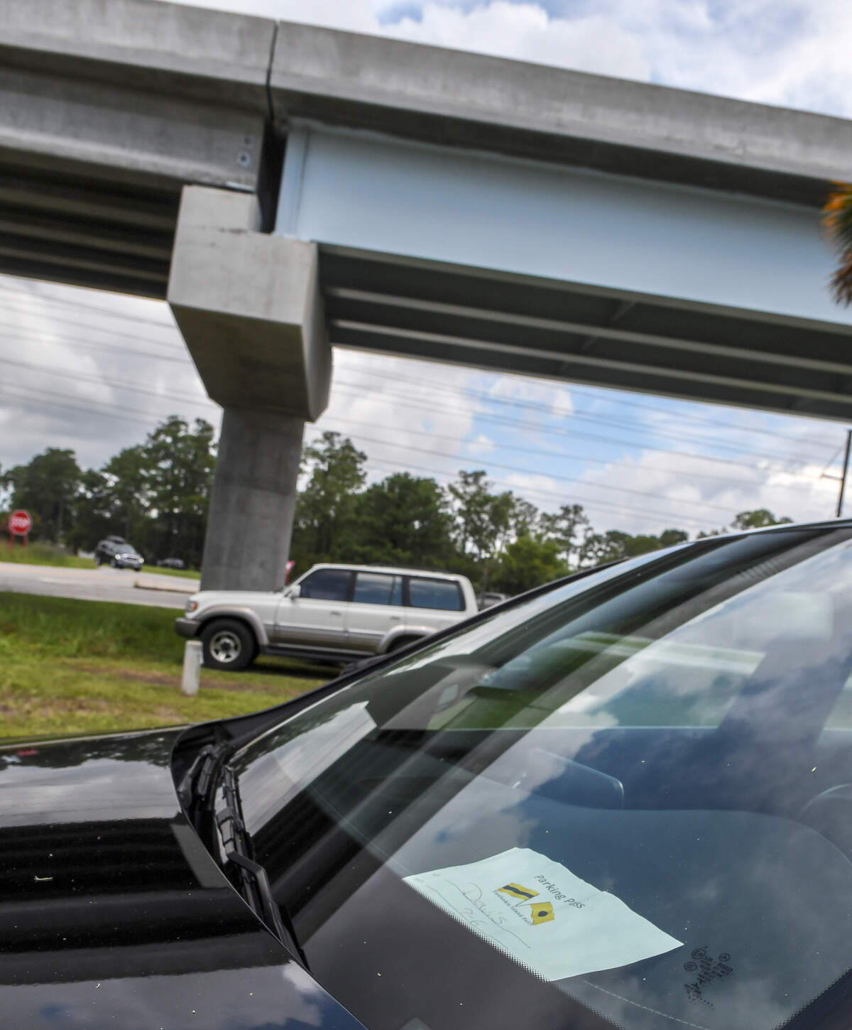 Several vehicles were parked on Wedensday afternoon under the Bluffton Parkway Flyover at Fording Island Road Extension in Bluffton. Several of the cars had what resembled parking permits displayed on their dashboard that noted vehicles were owned by workers of the fruit stand, property owners on Daufuskie Island or were utilizing the Daufuskie Island Ferry service. According to a spokesperson with the S.C. Department of Transportation, the vehicles are parked illegally on state property and that the permits issued are not legal.