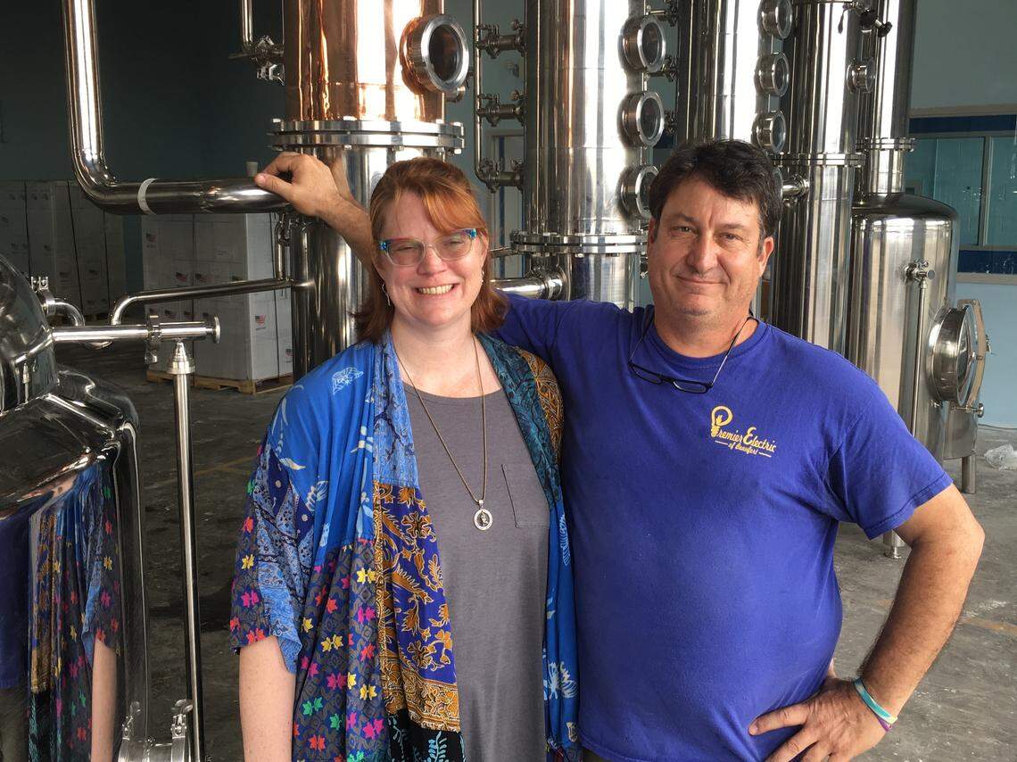 This file photo shows Brigid Fackrell and her husband, Brian, on Jan. 15, 2020 with recently delivered equipment at RLB Distillery, a business the couple is starting in Beaufort. The distillery will offer liquor tastings and sales of the product distilled on site in the former KMart store building.
