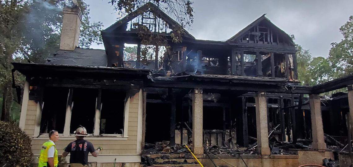 A photo taken Friday morning shows the fire damage to the rental home on Dinghy Lane.