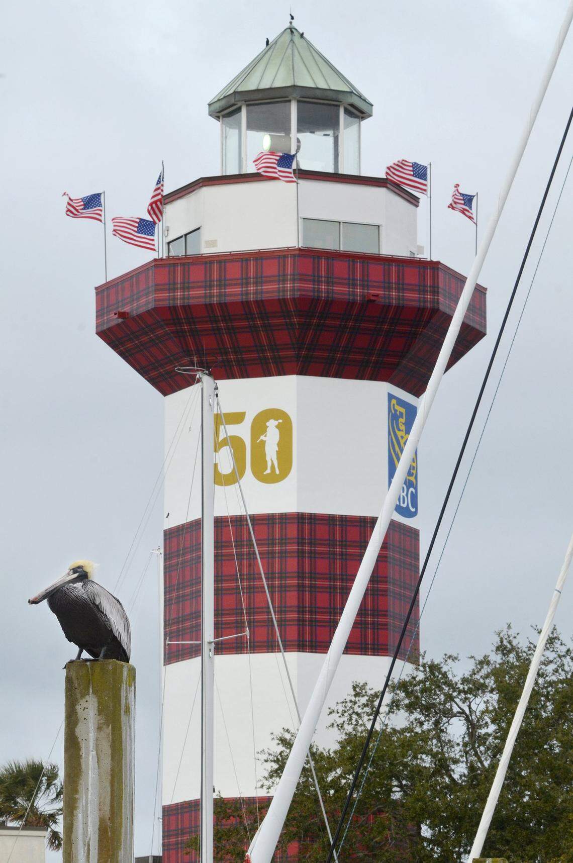 The Heritage plaid-clad Harbour Town Lighthouse looks out over the yacht basin and nearby 18th hole of Harbour Town Golf Links. The lighthouse's red stripes were converted to Heritage plaid for the RBC Heritage Presented by Boeing golf tournament's 50th anniversary.