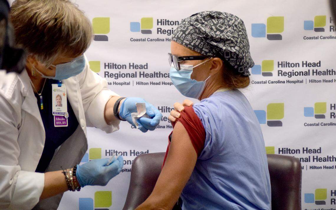 Dr. Amy Ramey, an emergency room physician at Hilton Head Hospital, receives the first dose of a Pfizer-BioNTech coronavirus vaccine on Wednesday, Dec. 16, 2020 on Hilton Head Island.