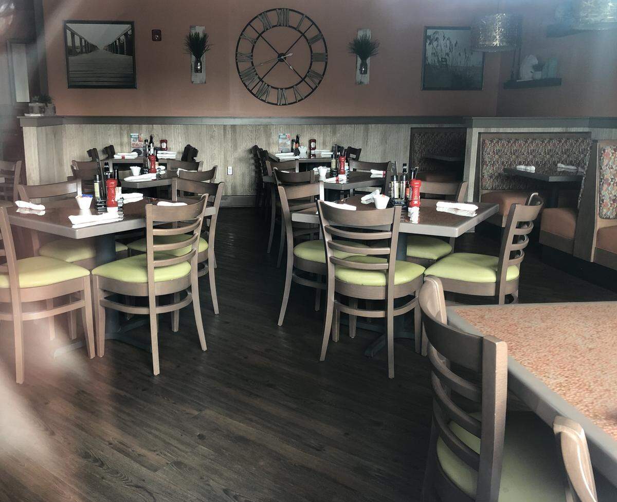 Tables are set although Another Broken Egg Cafe appears closed on Hilton Head Island Jan. 16.