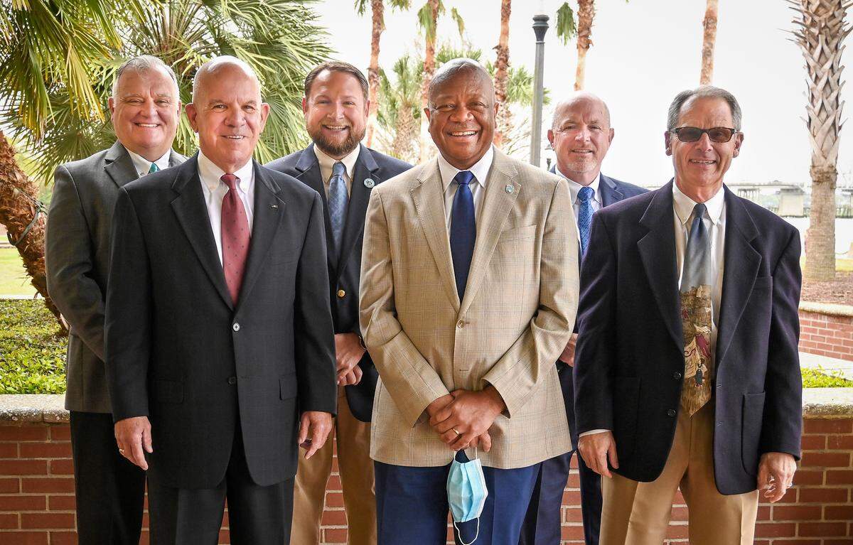 Leaders in higher education, local government and economic development in Beaufort County are collaborating to build cybersecurity programs at the University of South Carolina Beaufort and Technical College of the Lowcountry. Pictured (from left to right) are Dr. Rich Gough, president of TCL; Warren Parker, chairman of the nonprofit South Coast Cyber Center; Stephen Murray, Beaufort mayor and vice chairman of South Coast Cyber Center; Dr. Al Panu, USCB chancellor; John O’Toole, executive director of the Beaufort County Economic Development Corp.; and Kevin Klingler, chairman of Beaufort Digital Corridor.