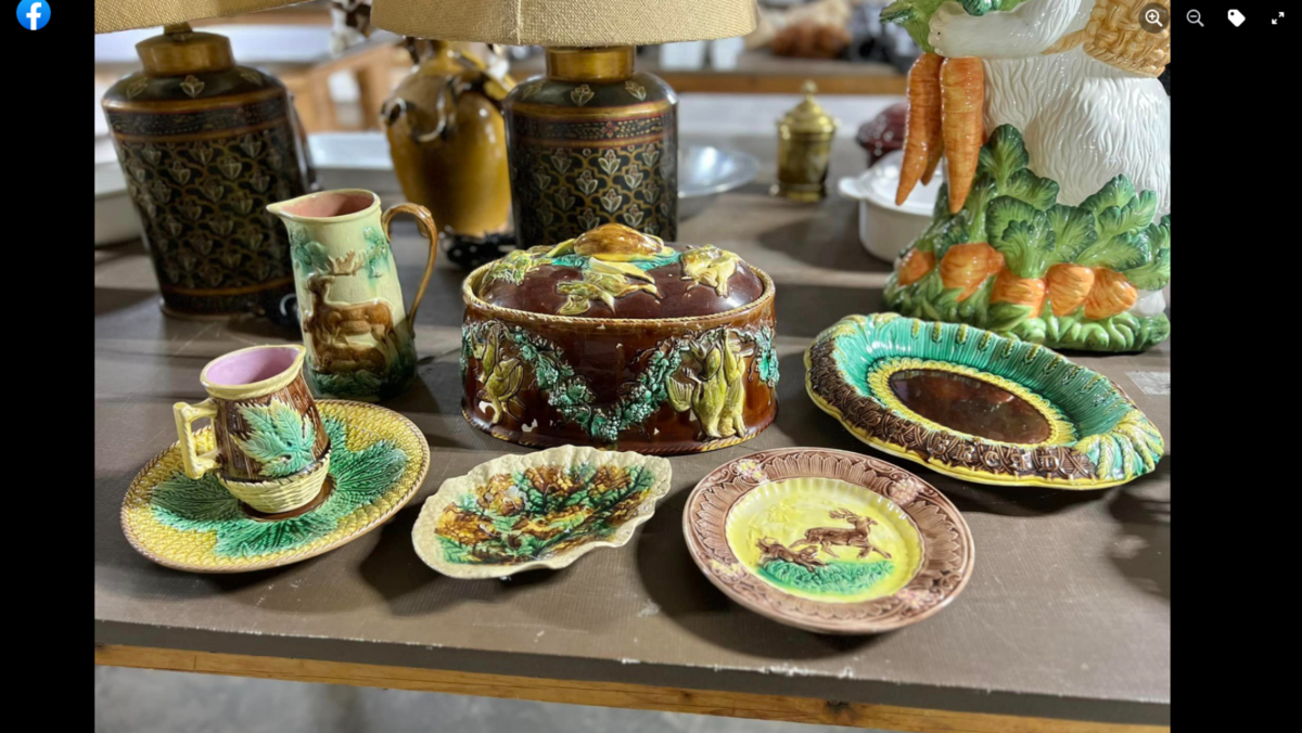 Some of the household items for sale include a leather living room set, lamp, various animal hunting trophies and dishware.