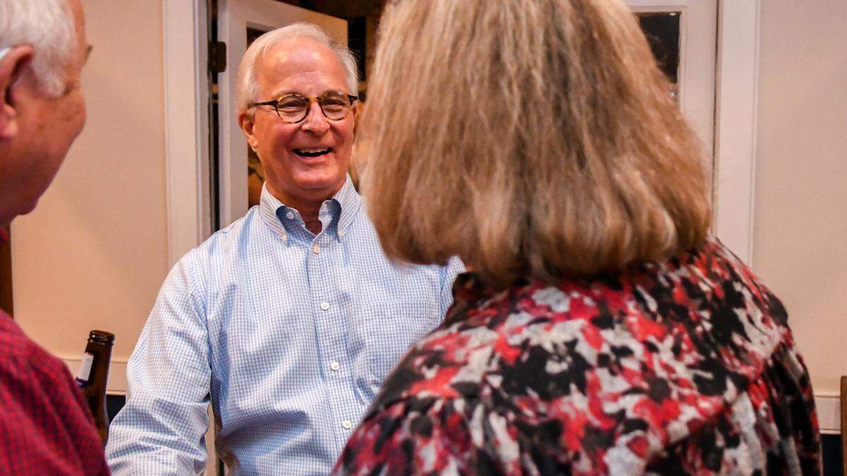 City of Beaufort Mayor Phil Cromer, center, chats with his supporters at his re-election watch party at Beaufort Yacht and Sailing Club on Tuesday, Nov. 5, 2024, on Lady’s Island in Beaufort. Cromer was won the mayoral race against Josh Scallate.