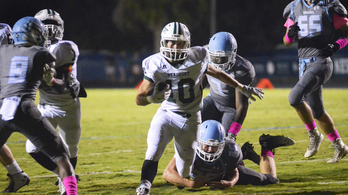 Beaufort?s Wyatt Sherpensky breaks through the Seahawk defense for a touchdown during Friday?s game.