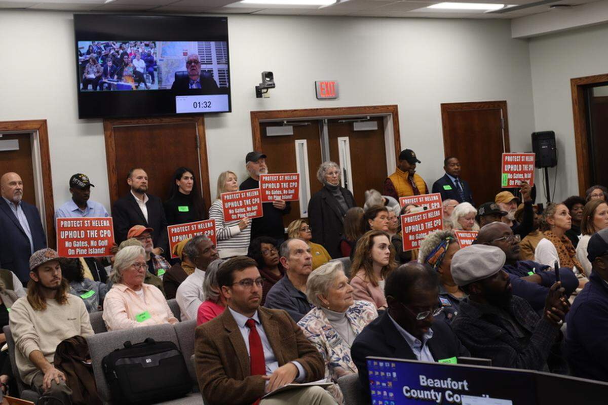 More than 200 members of the public showed up to a Beaufort County Council meeting on Dec. 8, 2025. Many arrived with signs calling for the council to uphold St. Helena’s Cultural Protection Overlay, which has prohibited resorts, gated communities, and golf courses since the late 1990s to preserve Gullah-Geechee culture.