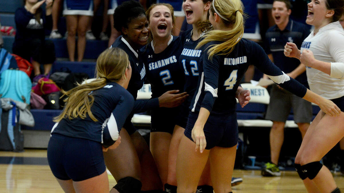 Hilton Head Island High?s volleyball team celebrates after winning the Class 3-A Lower State Volleyball final against Myrtle Beach High School on Tuesday night at Hilton Head Island High School.