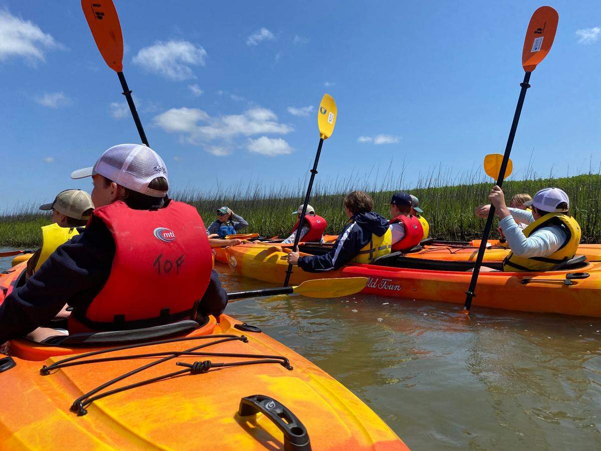 A group of Hilton Head Christian Academy seventh graders kayaking along the Broad Creek River to learn about the environment around them and how to protect it Monday, May 9, 2022 on Hilton Head Island.