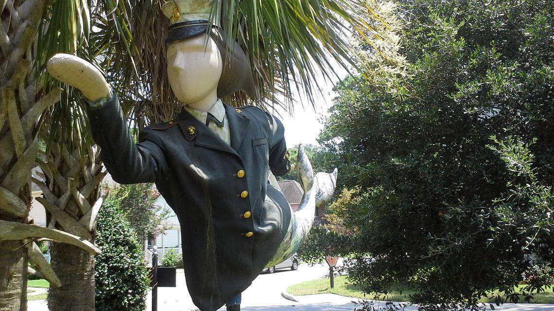 A mermaid from Beaufort's past public art project is displayed in the green space along Broad Street.