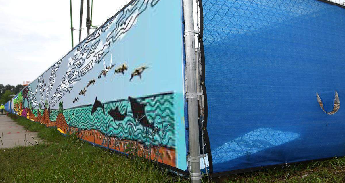 This photo illustration is a representation of how a mural will be used on construction fencing along Pope Avenue rather than the normal construction material, as seen on the right, that would normally be used to block construction sites according to the Town of Hilton Head Island. Local artist Jessie Renew produced the mural that will be placed on the construction fencing fronting Pope Avenue during the construction of the town’s Lowcountry Celebration Park.