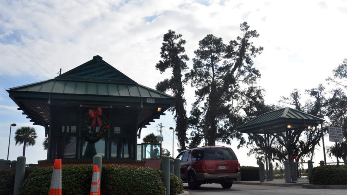Wreaths hang on the guard house at the gate to the Marine Corps Recruit Depot Parris Island on Dec. 21, 2012, as a vehicle waits to enter the base. 