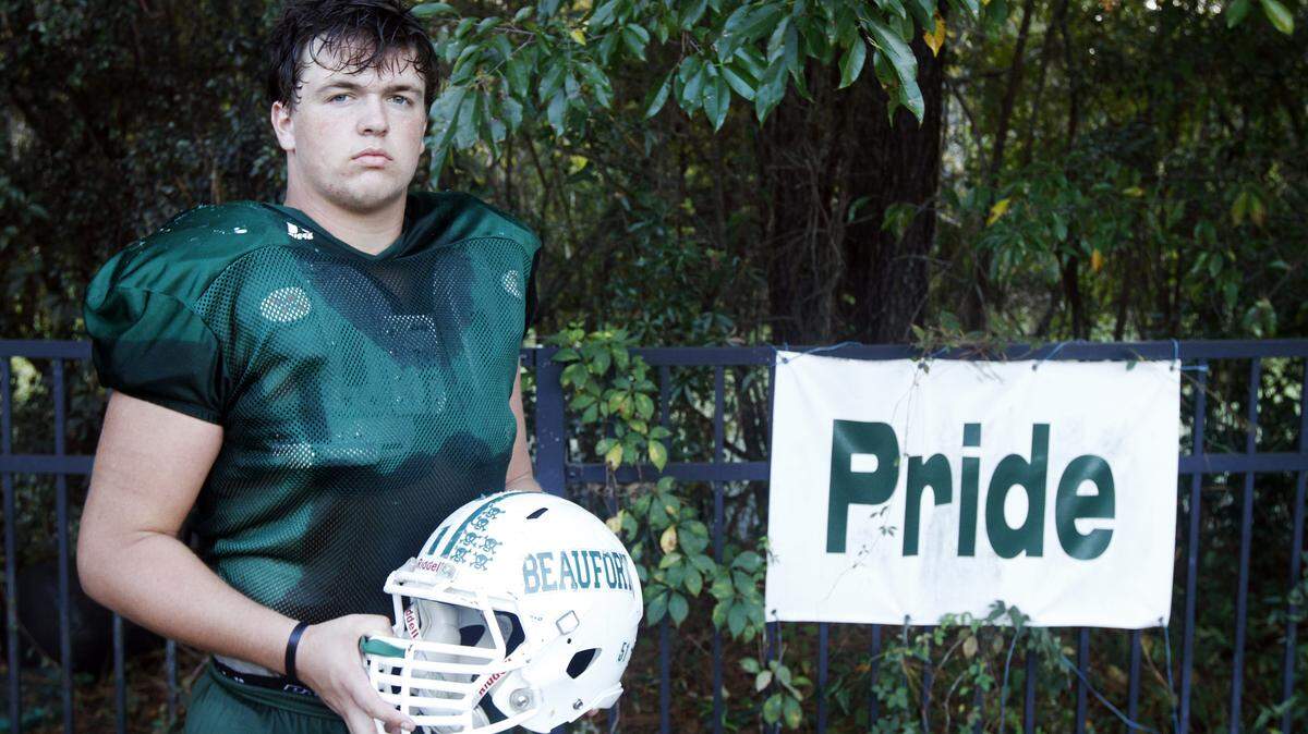 Beaufort High School linebacker Andrew Smyth leads the Eagles in tackles this season while also playing offensive line. He is coached by his father, defensive coordinator Andy Smyth, not pictured, who also played football at Beaufort High School. Andy Smyth requires a golf cart to maneuver around practice after complications due to a hip replacement a few years ago.