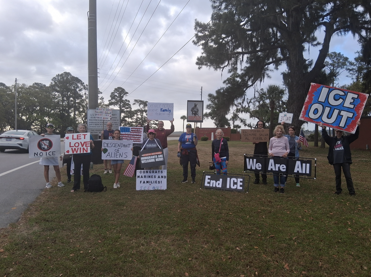 A group of demonstrators with the Lowcountry Immigration Coalition gathered outside the Marine Corps Recruit Depot Parris Island on April 3, 2026. After initially signaling that federal immigration officers could be part of heightened security at Parris Island ahead of graduation and family day, federal officials now say ICE agents will not attend upcoming recruit family and graduation events.