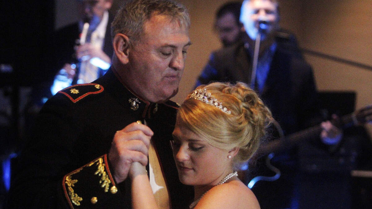 Bride Alicia Wilson dances with her father, Leroy Pennington, during her wedding Saturday in Port Royal. Singer Edwin McCain performed.