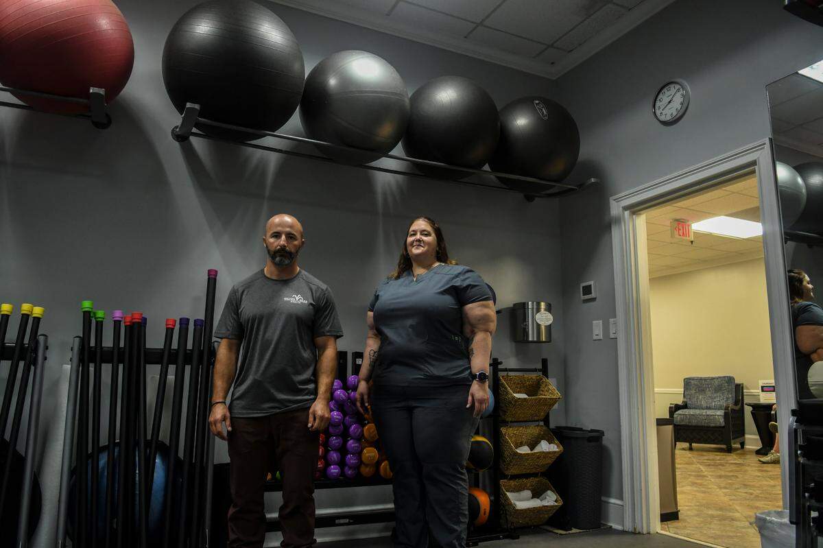 Hilton Head Health’s trainer Matt Barrack, left and massage therapist Rachel Sharp both benefit from the wellness resort’s employee-assisted housing, the two photographed in the fitness center on Thursday, Aug. 18, 2022 on Hilton Head Island. The resort’s owner has bought island properties, rehabbed them and rents them to his employees at affordable rates that allow them to live on the island.